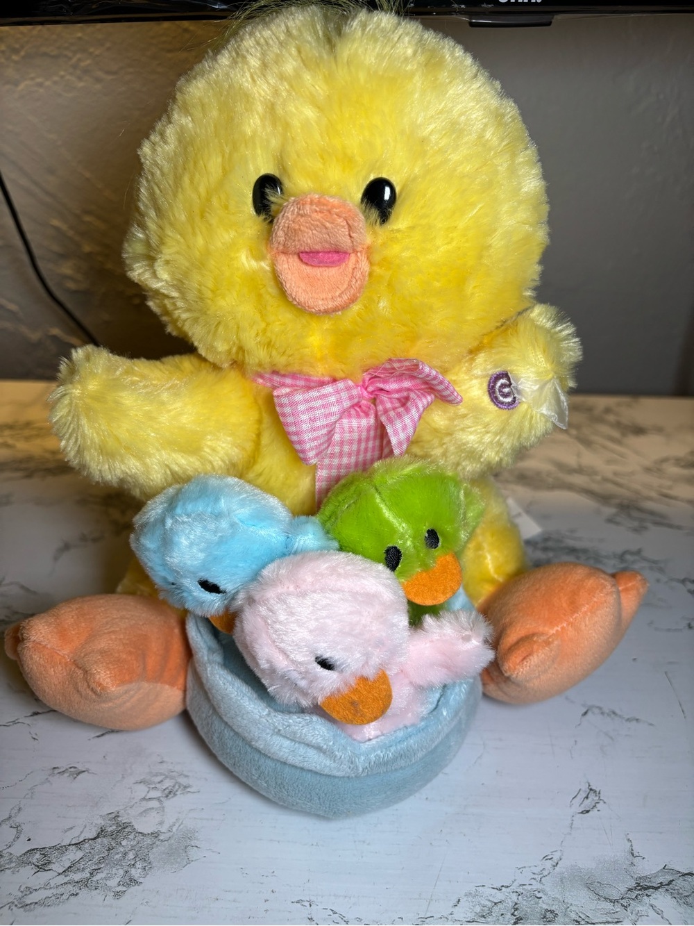 Yellow Plush Duck with Pink Bow and Trio of Pastel Ducklings